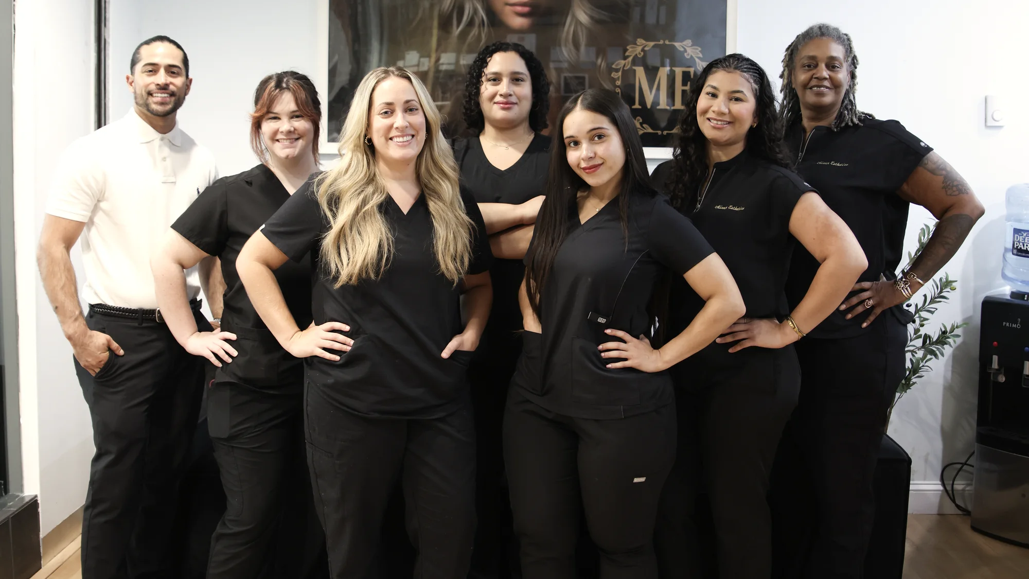 The Mirror Esthetics team standing together in the studio at Hanes Mall, Winston-Salem